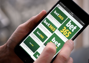 Image of a person looking at bet 365 on phone